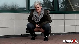 Chesty mature Bree pissing in the masses
